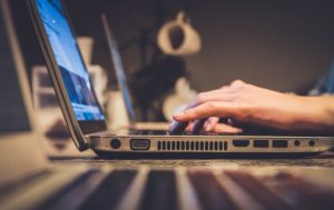 Picture of person typing on computer