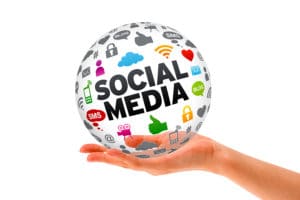Picture of hand holding social media globe