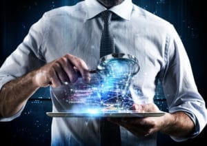 Picture of person looking at a tablet with magnifying glass