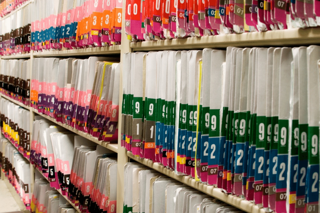 Image of medical records in a filing room.